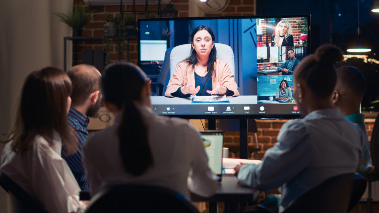 Business people attending a video conference meeting